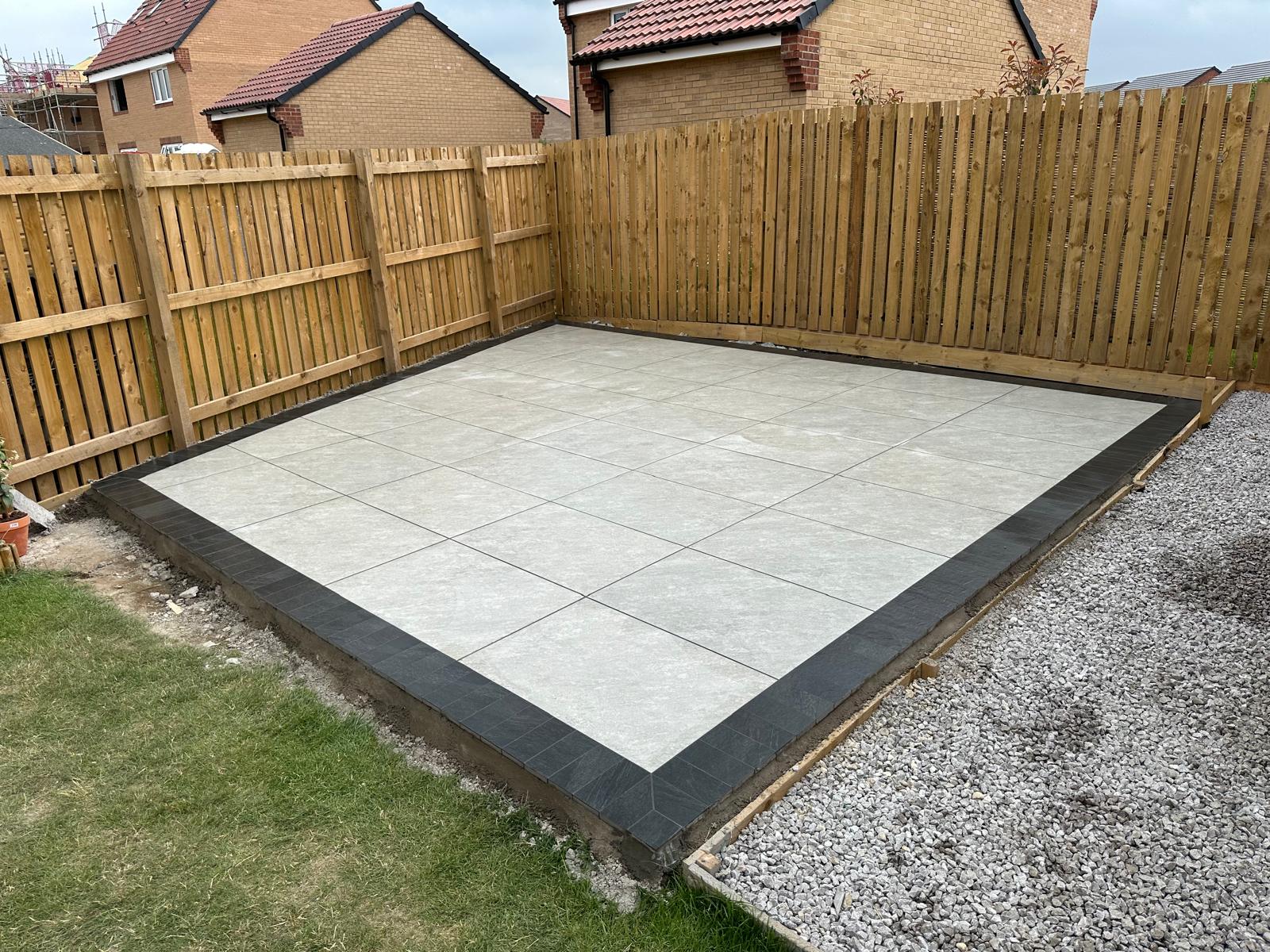 Finished porcelain patio with charcoal edging